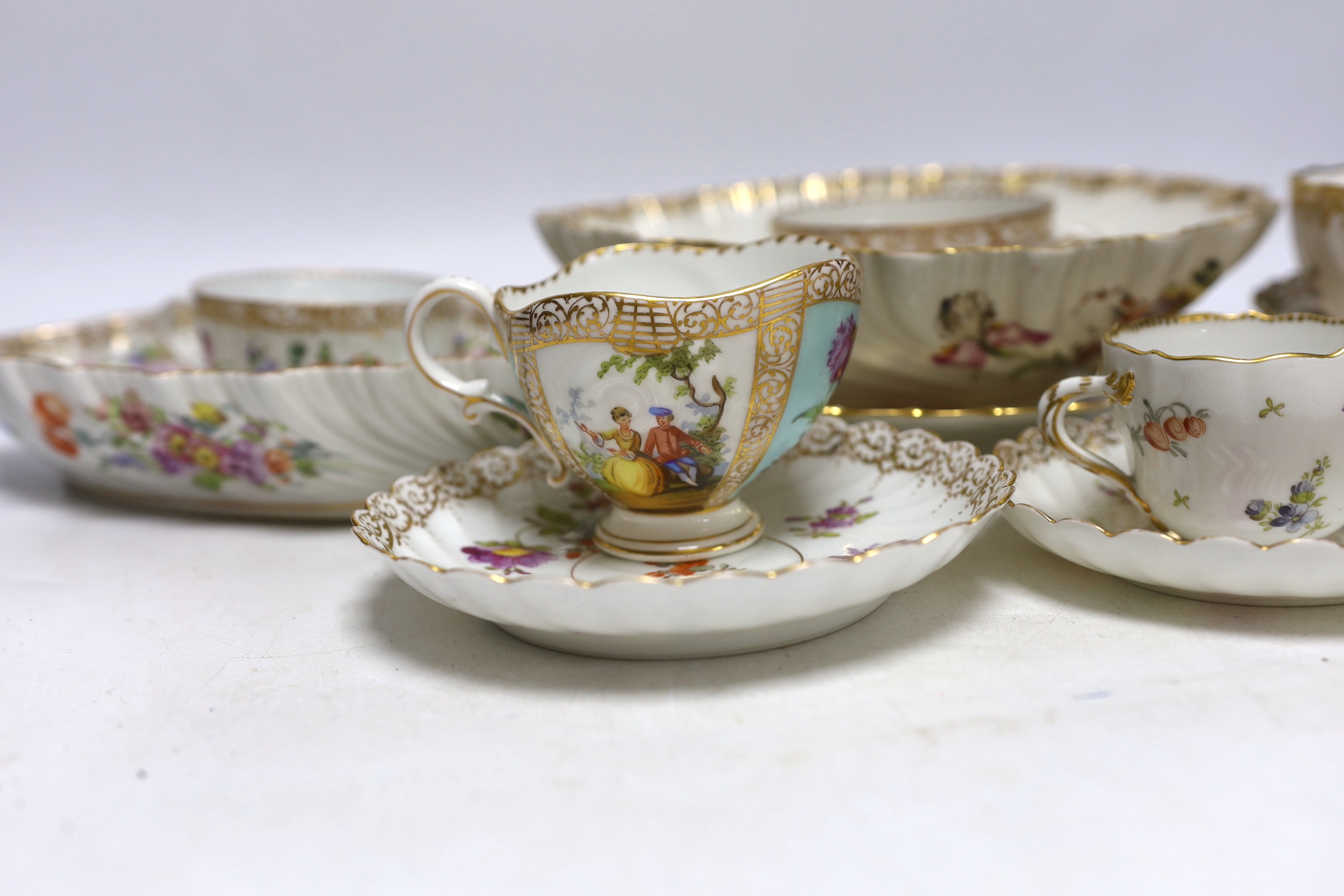 A group of Dresden porcelain floral tea wares, largest 24cm in diameter